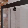 Schwarze Laufrolle an der Duschabtrennung aus Glas, Backsteinwand im Hintergrund Produktbild-Vorschau