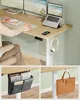 A person working at a standing desk with multiple monitors, laptop, and accessories. Náhled obrázku produktu