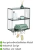 A black metal wall shelf with two shelves and hooks, displaying toiletries, towels, and bath accessories. Produktbild-Vorschau
