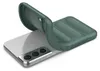 A green phone case is shown being placed onto a silver smartphone. Produktbild-Vorschau