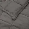 A close-up view of a quilted gray weighted blanket. Produktbild-Vorschau
