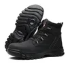 A pair of black work boots is shown against a white background. One boot is standing upright, while the other is placed upside down, showing its sole. Produktbild-Vorschau