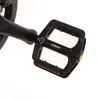 A close-up view of a black bicycle pedal. Produktbild-Vorschau