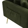 Close-up of the side of a green sofa with a pocket and a gold leg. Anteprima dell’immagine prodotto