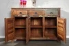 A wooden sideboard with three drawers and three cabinet doors, all open, showcasing the interior shelves. Náhled obrázku produktu