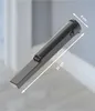 A close-up product shot of a dark gray stick vacuum cleaner with measurement indicators. Produktbild-Vorschau