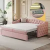 A pink upholstered daybed with an extended mattress, set up in a living room. Produktbild-Vorschau