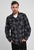 A man wearing a plaid shirt. Produktbild-Vorschau