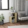 A bedside table next to a chair and a plant. Náhled obrázku produktu