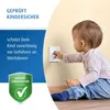 A baby is reaching for an electrical outlet, with a safety certification badge and text on the left side of the image. Náhľad obrázku produktu