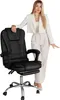 A woman in business attire posing next to a black office chair. Produktbild-Vorschau