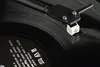 A close-up shot of a record player's stylus on a vinyl record. Anteprima dell’immagine prodotto