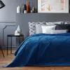 A bedroom scene with a bed, nightstand, and decorative items. Produktbild-Vorschau