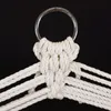 A close-up of the top of a macrame hammock chair or swing, showing the metal ring and the knotting detail. Produktbild-Vorschau