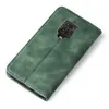 A green flip case for a smartphone is shown from a diagonal top-down view against a white background. Produktbild-Vorschau