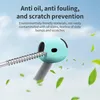 A close-up of a teal earbud case with a screw being inserted, surrounded by floating green leaves against a light blue sky. Voir les images du produit