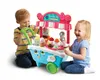 Two young children are playing with a VTech Scoop & Learn Eiswagen toy. Anteprima dell’immagine prodotto