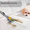 A vacuum cleaner attachment is cleaning a white couch, with a dog resting on the couch in the background. Náhled obrázku produktu