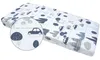 A fitted crib sheet with a pattern of retro cars and trees. Produktbild-Vorschau