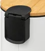 Close-up of the lid and hinge mechanism of a white trash can with a wooden lid. Podgląd zdjęcia produktu