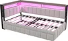 A light gray upholstered corner sofa bed with a wooden frame and pink LED lighting. Podgląd zdjęcia produktu