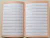 An open notebook with lined pages. Produktbild-Vorschau