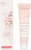 A product shot of a Clarins Calm-Essentiel Repairing Soothing Balm tube and its packaging, presented side-by-side on a white background. Anteprima dell’immagine prodotto