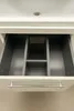 An open drawer with a built-in organizer. Produktbild-Vorschau