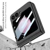 A black phone case is shown at an angle, appearing to be dropped onto a concrete surface. Produktbild-Vorschau