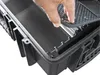 A hand is shown placing a textured mat into a black tool case. Podgląd zdjęcia produktu