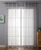 A window with sheer gray curtains covering it. Produktbild-Vorschau