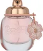 A perfume bottle with a flower charm. Voir les images du produit