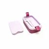 A purple and pink lunchbox with a fork and spoon inside, shown with its lid off to the side. Anteprima dell’immagine prodotto