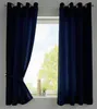 A window with dark blue curtains tied back, revealing a view of trees outside. Produktbild-Vorschau