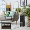 A living room scene featuring a couch, plants, and an air cooler. Podgląd zdjęcia produktu