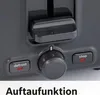 Close-up of a gray toaster with control buttons. Voir les images du produit