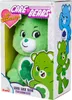 A plush toy of Good Luck Bear from Care Bears is displayed in its retail packaging. Produktbild-Vorschau