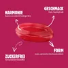 A single red candy is shown with text annotations highlighting its features. Produktbild-Vorschau