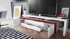 A modern living room with a TV stand, TV, and a chair. Produktbild-Vorschau