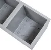 Close-up view of two gray plastic planters with drainage holes. Produktbild-Vorschau