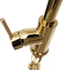 A close-up shot of a gold-colored kitchen faucet. Podgląd zdjęcia produktu