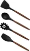 A set of four kitchen utensils with black silicone heads and wooden handles, arranged vertically against a white background. Náhled obrázku produktu