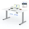 A white standing desk with a laptop, monitor, keyboard, mouse, and game controller on top. Diagrams show the desk's motor mechanism. A "Testsieger High Quality" badge is in the upper right corner. Anteprima dell’immagine prodotto