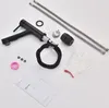A collection of kitchen faucet parts and accessories laid out on a white surface. Produktbild-Vorschau