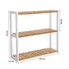 A three-tiered shelf unit with wooden shelves and white metal legs, shown against a white background with dimensions indicated. Náhled obrázku produktu