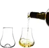 A bottle of white wine or spirit is being poured into a crystal glass, with another empty glass beside it. Náhľad obrázku produktu