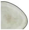 A close-up view of the edge of a plate. Produktbild-Vorschau