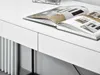 A close-up view of a white desk with an open book on it. Voir les images du produit
