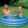 A woman and a child are playing in an inflatable pool in a backyard. Náhled obrázku produktu