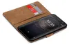 A brown flip case for a Sony Xperia XA2 phone, with two credit cards inserted into a slot. Anteprima dell’immagine prodotto